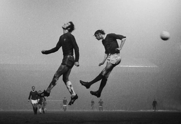 Manchester Uniteds Paul Edwards and Chelseas Peter Osgood jump for the ball at Old Trafford