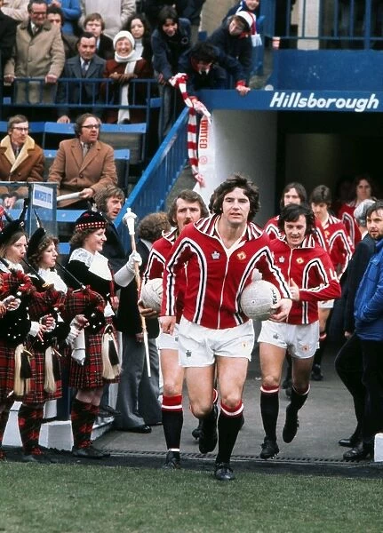 Martin Buchan leads out Manchester United in the 1976 FA Cup semi-final