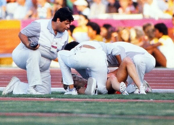 Mary Decker lies on the ground after crashing out of the 1984 Olympic 3000m final