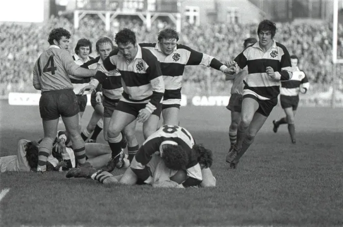 Framed Print : Mervyn Davies tackles an Australian player for the Barbarians in 1976 with his teammates moving in in support Framed Print : Mervyn Davies tackles an Australian player for the Barbarians in 1976 with his teammates moving in in support
