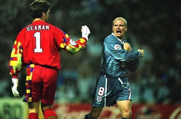 Paul Gascoigne and David Seaman celebrate during the penalty shoot-out against Germany at Euro 96