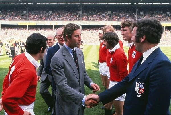Prince Charles shakes hands with British Lions coach John Dawes before the 1977 Silver Jubilee Match
