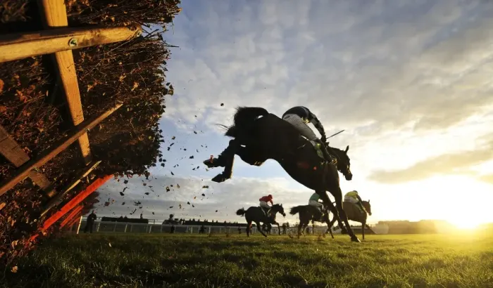 Framed Print : The riders clear the last hurdle of the 15: 05 Stan James International Hurdle at Cheltenham racecourse