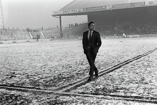 Spurs captain Dave Mackay inspects a snowy Maine Road