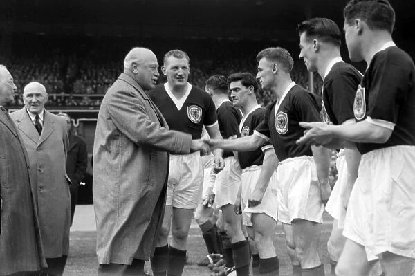 Tommy Docherty shakes hands with the Earl of Rosebery before facing England in the 1957 Home Championship