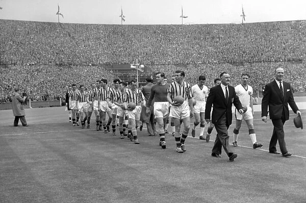 United manager Matt Busby and Villa manager Eric Houghton lead their sides out for the 1957 FA Cup Final