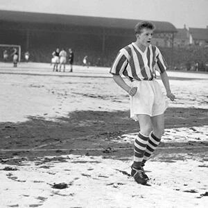 A 16 year-old Denis Law in the snow for Huddersfield in the FA Cup