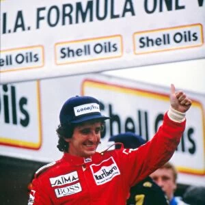 Alain Prost celebrates winning his first world title in 1985