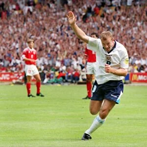 Alan Shearer celebrates scoring the opening goal of Euro 96