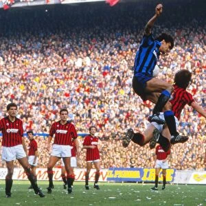 Alessandro Altobelli and Mark Hateley compete in the air during the Milan Derby in 1984