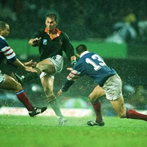Andre Joubert kicks ahead in the rain during the 1995 Rugby World Cup semi-final