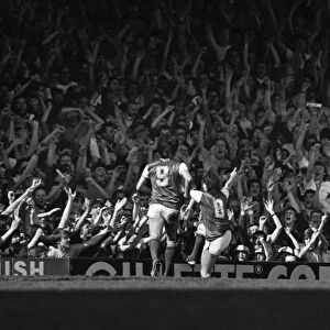 Arsenals Charlie Nicholas celebrates in front of the North Bank