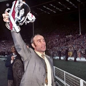 Aston Villa manager Ron Saunders displays the League Cup after victory in 1975