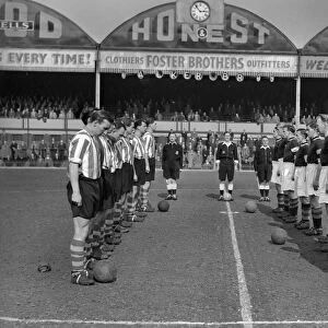 Aston Villa and Stoke City observe a minutes silence at Villa Park for the death of Queen Mary in 1953