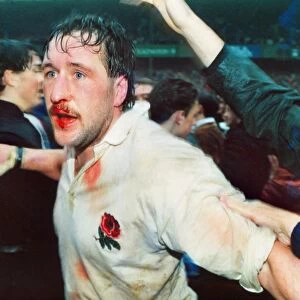 A bloodied Mike Teague celebrates Englands Grand Slam victory - 1991 Five Nations