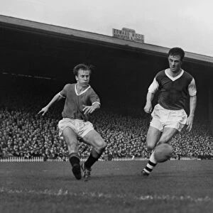 Bobby Charlton crosses the ball against Arsenal in 1958