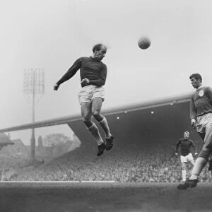 Bobby Charlton leaps to head the ball in the 1964 / 5 season