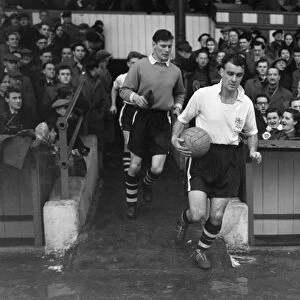 Burys Stan Pearson leads out his side at Gigg Lane during the 1955 / 6 FA Cup