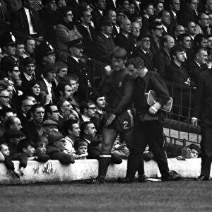 Chelseas David Webb leaves the field with an arm injury at Elland Road in 1969