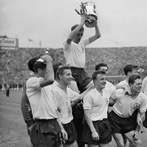 Danny Blanchflower celebrates with his teammates after Tottenham win the FA Cup in 1961