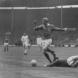 Denis Law evades Gordon Banks during the 1963 FA Cup Final
