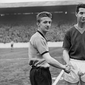 Denis Law shakes hands with Leeds Freddie Goodwin on his debut for Manchester City in 1960