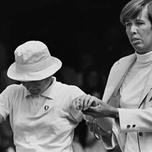 Doris Hart helps the injured Nancy Richey from the court - 1970 Wightman Cup