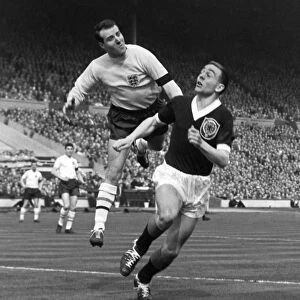 England goalkeeper Ron Springett punches clear from Ian St. John - 1960 / 1 British Home Championship