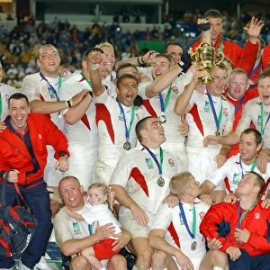 The England team celebrate after winning the rugby World Cup