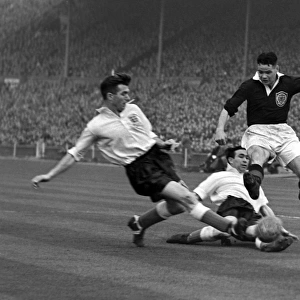 Englands Malcolm Barrass slides in to tackle Billy Liddell - 1952 / 3 British Home Championship