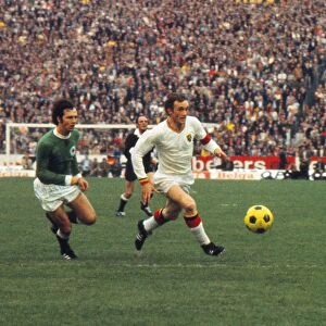 Franz Beckenbauer and Paul Van Himst run for the ball at Euro 72