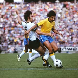 Franz Beckenbauer tackles Rivelino in 1973