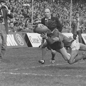 Gerald Davies dives into the corner to score during the 1974 Five Nations