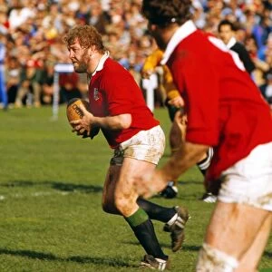Graham Price runs with the ball for the Lions in 1983