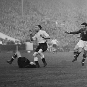 Hungary goalkeeper Gyula Grosics dives at the feet of Englands Stan Mortensen at Wembley in 1953