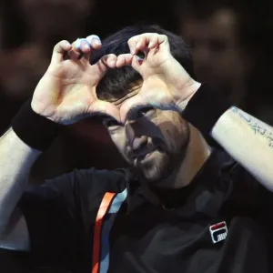 Janko Tipsarevic celebrates victory over Novak Djokovic at the ATP World Tour Finals