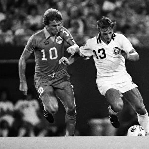Johan Neeskens is challenged by Alan West during the 1979 NASL