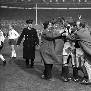 Jubliant fans mob Denis Law and Willie Henderson after Scotlands victory over England in 1963