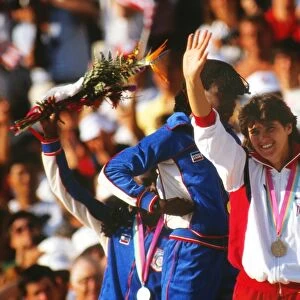 Kathy Cook waves to the crowd on the podium at the 1984 Los Angeles Olympics