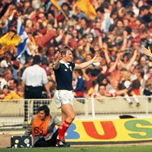Kenny Dalglish celebrates his goal with Bruce Rioch in front of the Scotland fans at Wembley - 1977 British Home Championship