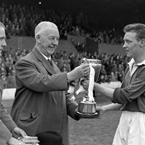 Manchester United captain Eddie Colman receives the FA Youth Cup in 1955