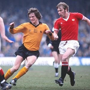 Manchester Uniteds Brian Greenhoff and Wolves Mel Eves
