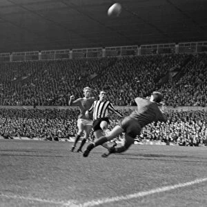 Manchester Uniteds Denis Law takes on Newcastle in 1966