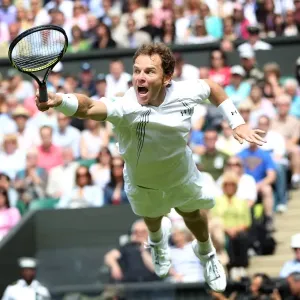 Michael Russell dives to return a shot during the 2011 Wimbledon Championships