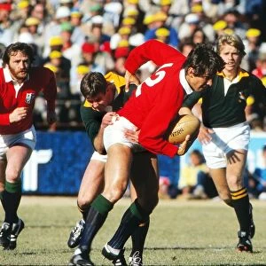 Paul Dodge on the ball for the Lions, with teammate Ray Gravell in support, during the 4th Test against the Springboks in 1980