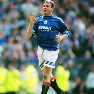 Paul Gascoigne celebrates scoring a hat-trick for Rangers in 1996