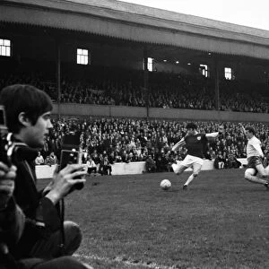 Photographers watch the action at Turf Moor in 1967