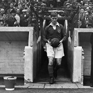 Portsmouth captain Jimmy Dickinson leads his side out at Fratton Park in 1955