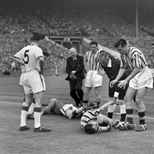 Ray Wood and Peter McParland go down injured in the 1957 FA Cup Final