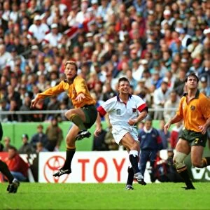 Rob Andrew watches his game-winning drop-goal sail through the posts in the 1995 Rugby World Cup quarter-final against Australia